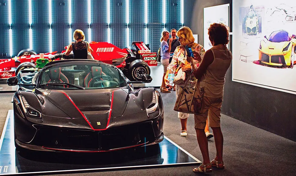 Ultimate Driving Tours’; guests take photos of a rare prototype car at Ferrari’s famous Maranello factory in Italy