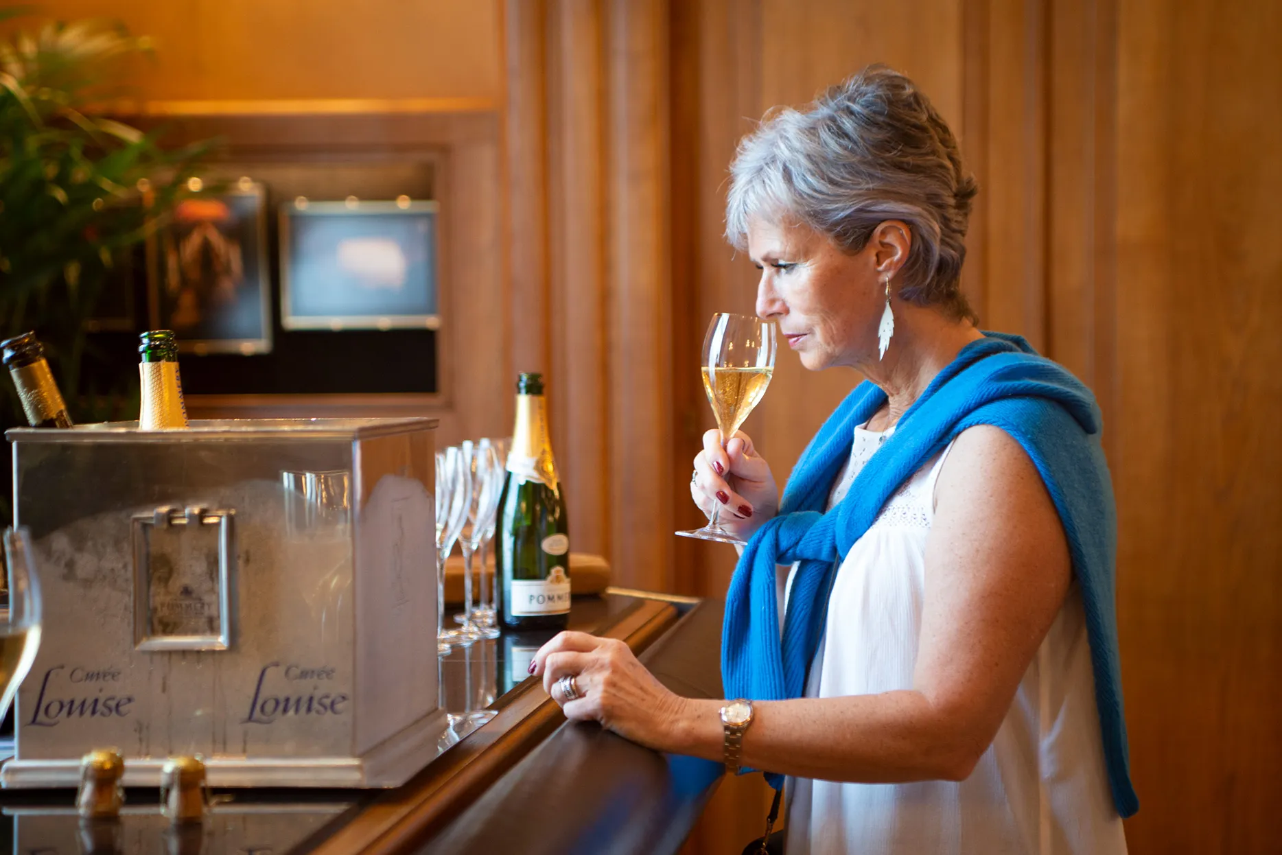 A woman taking part in a Champagne tasting in France